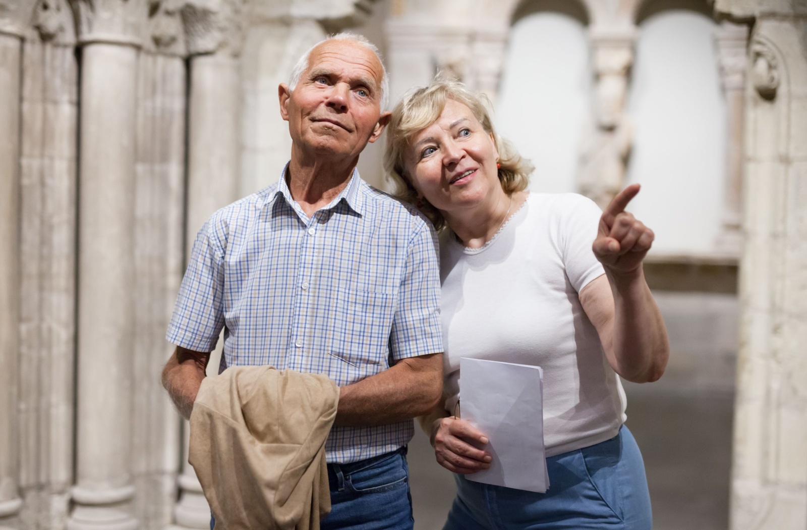 A senior couple enjoys a day out at a local museum learning about their country’s history